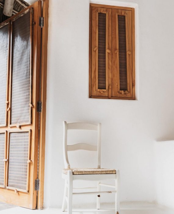 photo-of-chair-near-wooden-door-3259922